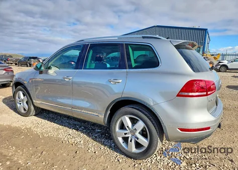 2013 Volkswagen Touareg Hybrid z USA, uszkodzony, nr VIN WVGEG9BP0DD013907